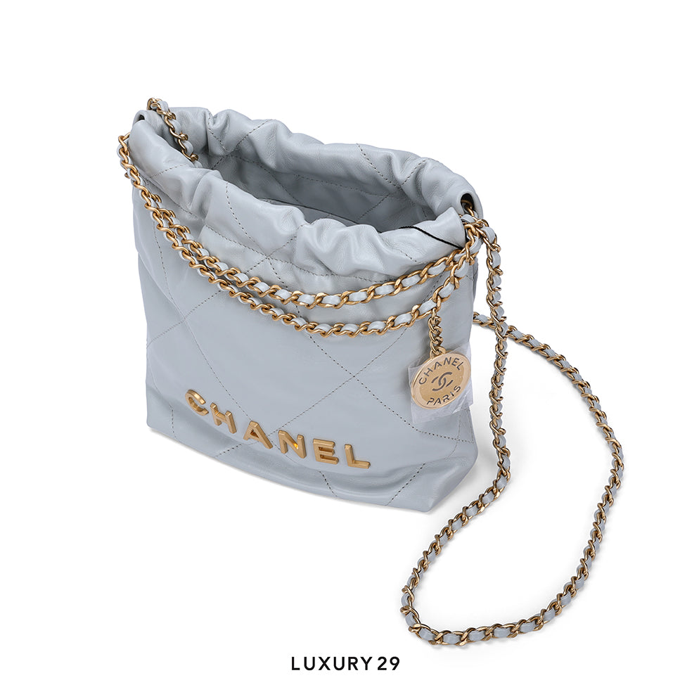Chanel 22 Mini Handbag Shiny Calfskin & Gold-Tone Light Blue CHANEL